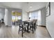Cozy dining area with stylish furnishings, plenty of natural light and modern light fixtures at 11680 Imboden Rd, Hudson, CO 80642