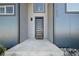 Close-up of the modern front door with contemporary design and sleek hardware, adding curb appeal at 11680 Imboden Rd, Hudson, CO 80642