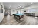 This spacious game room features a pool table and a bar area perfect for entertaining guests at 11680 Imboden Rd, Hudson, CO 80642