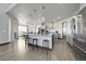 Gourmet kitchen with stainless steel appliances, a large island, and modern pendant lighting at 11680 Imboden Rd, Hudson, CO 80642