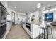 Gourmet kitchen with a large island, stainless steel appliances, and open layout to the living room at 11680 Imboden Rd, Hudson, CO 80642