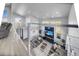 Bright modern living area with a fireplace, recessed lighting, a ceiling fan, and outdoor views at 11680 Imboden Rd, Hudson, CO 80642