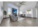 Inviting living room with high ceilings, gas fireplace, large windows, and modern furniture at 11680 Imboden Rd, Hudson, CO 80642