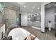 Bright bath features a modern shower, stylish lighting, dual vanities, and a separate toilet room at 11680 Imboden Rd, Hudson, CO 80642