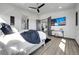 A sprawling main bedroom flows into an ensuite bath and features a wall-mounted TV at 11680 Imboden Rd, Hudson, CO 80642