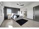Well lit main bedroom features a ceiling fan, modern finishes, and ensuite bath with glass shower at 11680 Imboden Rd, Hudson, CO 80642