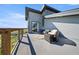 Outdoor deck with comfortable seating, outdoor rug, and scenic views of the surrounding landscape at 11680 Imboden Rd, Hudson, CO 80642