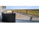 Relaxing outdoor patio with comfortable seating, stylish rug, and scenic views of the surrounding landscape at 11680 Imboden Rd, Hudson, CO 80642