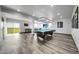 Finished basement recreation room with a pool table, bar seating, and bright natural light at 11680 Imboden Rd, Hudson, CO 80642
