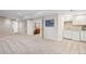Finished basement with a kitchenette area and ample open space with carpet flooring at 5331 S Geneva Way, Englewood, CO 80111
