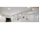 Spacious finished basement with recessed lighting, large windows and neutral walls at 5331 S Geneva Way, Englewood, CO 80111