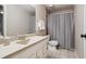 Neutral bathroom featuring a vanity with a tile floor and a shower with a curtain at 5331 S Geneva Way, Englewood, CO 80111
