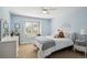 Cozy bedroom with natural light, neutral carpet and a large window at 5331 S Geneva Way, Englewood, CO 80111