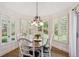 Bright breakfast area with shuttered windows and views of the backyard at 5331 S Geneva Way, Englewood, CO 80111