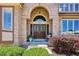 Elegant double doors welcome you to this home's inviting facade at 5331 S Geneva Way, Englewood, CO 80111