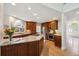 Spacious kitchen features granite countertops, stainless steel appliances, and dark wood cabinets at 5331 S Geneva Way, Englewood, CO 80111