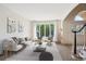 Bright living room with picture window has cozy seating and natural light at 5331 S Geneva Way, Englewood, CO 80111