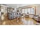 Cozy living room with hardwood floors, a china cabinet, and an inviting sofa at 4909 W Mississippi Ave, Denver, CO 80219