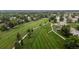 An aerial shot showcases a meticulously maintained golf course, with lush green fairways and scenic surroundings at 8738 Chase Dr # 134, Arvada, CO 80003