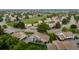 An aerial view of townhomes with lush green spaces and manicured lawns creates a serene and inviting neighborhood at 8738 Chase Dr # 134, Arvada, CO 80003