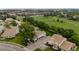 Aerial view of townhomes with tree-lined green space at 8738 Chase Dr # 134, Arvada, CO 80003