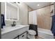Updated bathroom features illuminated mirror, modern vanity, and tiled shower-tub combination at 8738 Chase Dr # 134, Arvada, CO 80003