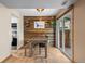Bright dining room with custom wood wall and access to the kitchen and back patio at 8738 Chase Dr # 134, Arvada, CO 80003