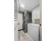 Efficient laundry room with stacked washer/dryer and added freezer for extra storage at 8738 Chase Dr # 134, Arvada, CO 80003