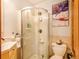 Cozy bathroom featuring tiled floors and walk in shower at 23778 Inca Rd, Indian Hills, CO 80454