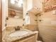 Bathroom with granite countertop, decorative mirror, and modern fixtures at 23778 Inca Rd, Indian Hills, CO 80454
