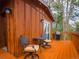 Relaxing deck area featuring a grill, table, and comfortable seating for outdoor enjoyment at 23778 Inca Rd, Indian Hills, CO 80454