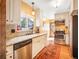Bright kitchen with stainless steel appliances, granite countertops, and white cabinetry at 23778 Inca Rd, Indian Hills, CO 80454