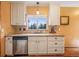 Bright kitchen features granite counters, a window with a view, and stainless steel dishwasher at 23778 Inca Rd, Indian Hills, CO 80454