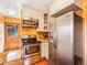 Modern kitchen boasts stainless steel appliances and convenient access to the outdoors at 23778 Inca Rd, Indian Hills, CO 80454