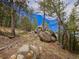 Beautiful lot dotted with mature trees and natural rock outcroppings creating a picturesque setting at 23778 Inca Rd, Indian Hills, CO 80454
