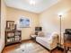 Cozy living room with a comfortable sofa, charming decor, and natural light from the window at 23778 Inca Rd, Indian Hills, CO 80454
