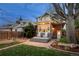 Charming backyard featuring a patio with rocking chairs and beautifully landscaped yard at 4130 Umatilla St, Denver, CO 80211