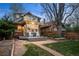 Backyard with a patio featuring rocking chairs, string lights, and landscaping at 4130 Umatilla St, Denver, CO 80211