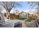 Well-maintained backyard with deck, paver patio, and a privacy fence at 4130 Umatilla St, Denver, CO 80211