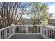 Backyard view from balcony showcasing neighboring homes and mature trees at 4130 Umatilla St, Denver, CO 80211