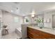 Modern bathroom with double vanity, sleek fixtures, large mirror, and luxurious tub at 4130 Umatilla St, Denver, CO 80211