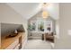 Bright bedroom with vaulted ceilings, accent lighting, and a built-in storage area at 4130 Umatilla St, Denver, CO 80211