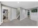 Spacious basement area with neutral carpet and multiple doorways, offering flexible living space at 15157 E Nassau Ave, Aurora, CO 80014