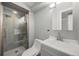 Updated bathroom featuring a tiled glass shower, modern vanity, and sleek fixtures for a spa-like experience at 15157 E Nassau Ave, Aurora, CO 80014