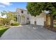 Charming two-story home featuring an attached two-car garage, well-kept lawn, and beautiful mature trees at 15157 E Nassau Ave, Aurora, CO 80014