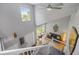 Bright foyer features hardwood floors and a grand staircase leading to the home's living spaces at 15157 E Nassau Ave, Aurora, CO 80014