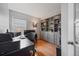 Well-organized home office with gray built-in shelving and natural light at 15157 E Nassau Ave, Aurora, CO 80014
