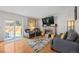 Comfortable living room with hardwood floors and a cozy brick fireplace at 15157 E Nassau Ave, Aurora, CO 80014