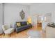 Bright and airy living room with hardwood floors, high ceilings, and modern decor at 15157 E Nassau Ave, Aurora, CO 80014