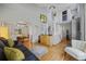 Spacious living room featuring hardwood floors, staircase, and modern decor at 15157 E Nassau Ave, Aurora, CO 80014